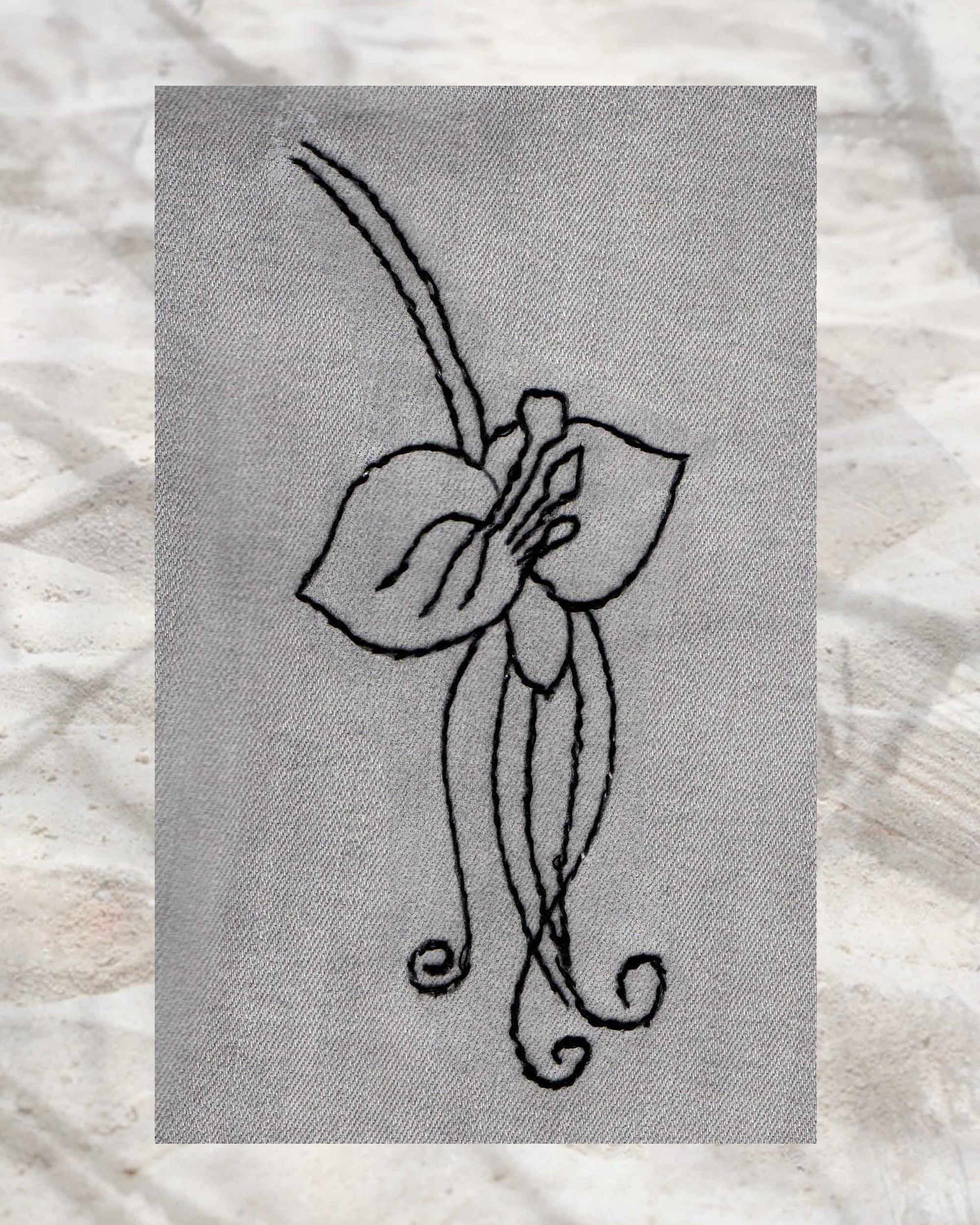 Raspberry Lane Crafts Black Orchid Embroidery Pattern PDF Download for sale buy purchase features a three-petal orchid with stamens and curly leaves and stem.  Ideal for embroidering on blue jeans.  Design by Wendy Christine.  Part of Orchid Fragrance Embroidery Pattern - three designs.