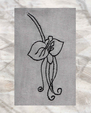 Raspberry Lane Crafts Black Orchid Embroidery Pattern PDF Download for sale buy purchase features a three-petal orchid with stamens and curly leaves and stem.  Ideal for embroidering on blue jeans.  Design by Wendy Christine.  Part of Orchid Fragrance Embroidery Pattern - three designs.