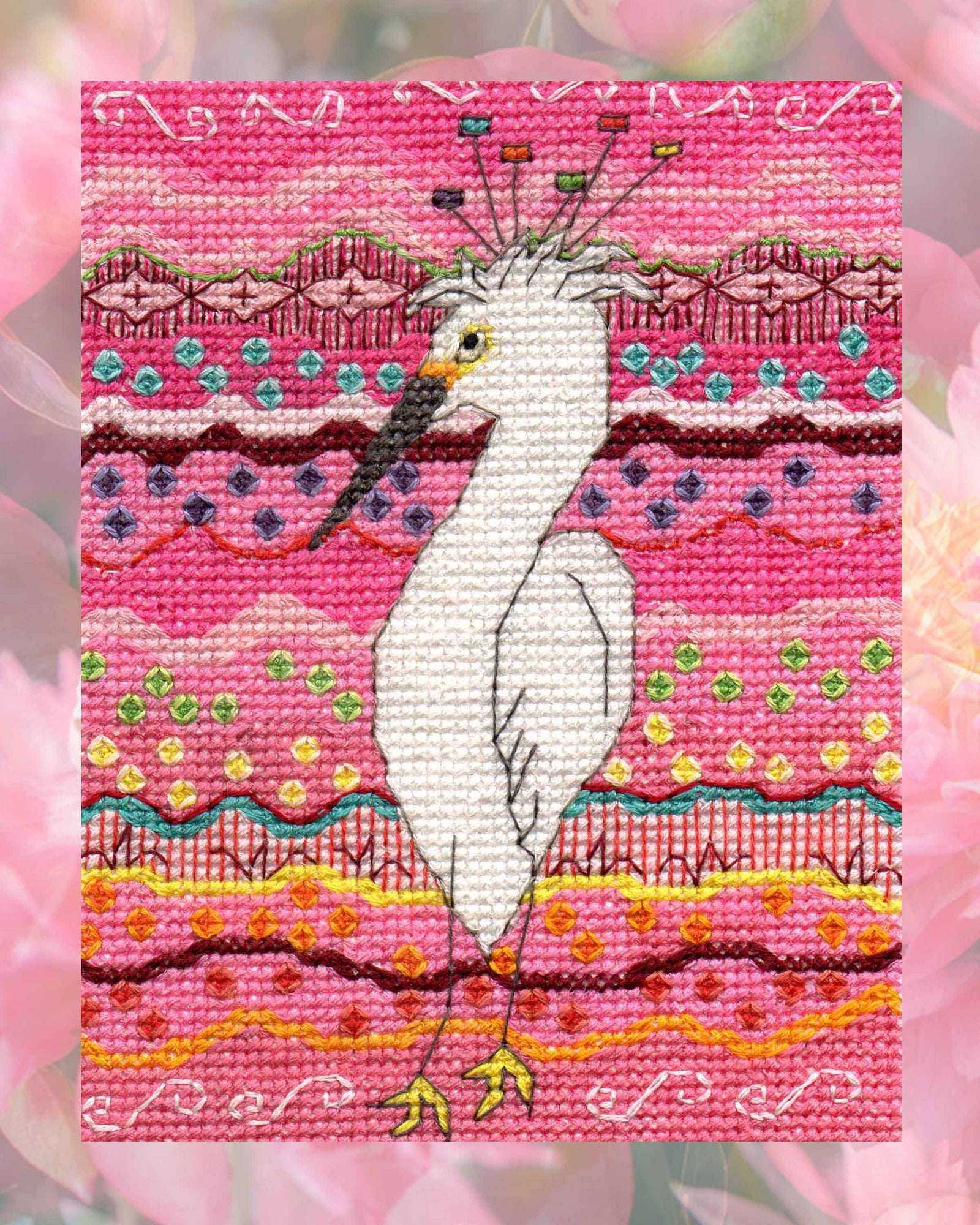 Brane Crane Cross Stitch PDF Pattern for sale features a white ibis water bird on a pink background with candy rainbow dots from The Art of Wendy Christine available only at Raspberry Lane Crafts.  Great pink room decoration!