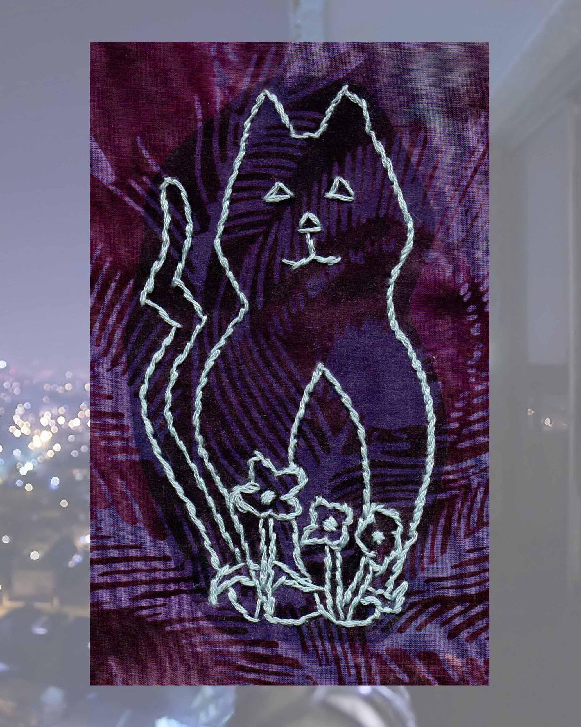 Raspberry Lane Crafts Garden Cat Embroidery Pattern PDF Download for sale buy purchase features a sitting cat with tail and three flowers on stems.  Design by Wendy Christine.  One of three cat designs in Kitty Bazaar Embroidery Pattern.