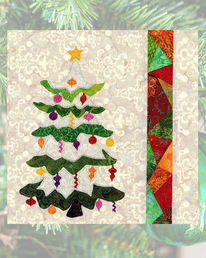Frosted Tree Quilt Pattern features a Christmas tree with snow white and green branches decorated with holiday ornaments with a yellow star atop and stained glass strip.  Block #2 of the Stained Glass Christmas by Wendy Christine at Raspberry Lane Crafts.  Purchase, buy PDF download at www.raspberrylanecrafts.com
