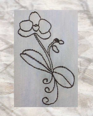 Raspberry Lane Crafts Orchid Majesty Embroidery Pattern PDF Download for sale buy purchase features a round petalled orchid with two buds and round leaves and three curls.  Ideal for embroidering on blue jeans.  Design by Wendy Christine.  One of three designs in the Orchid Fragrance Embroidery Pattern.