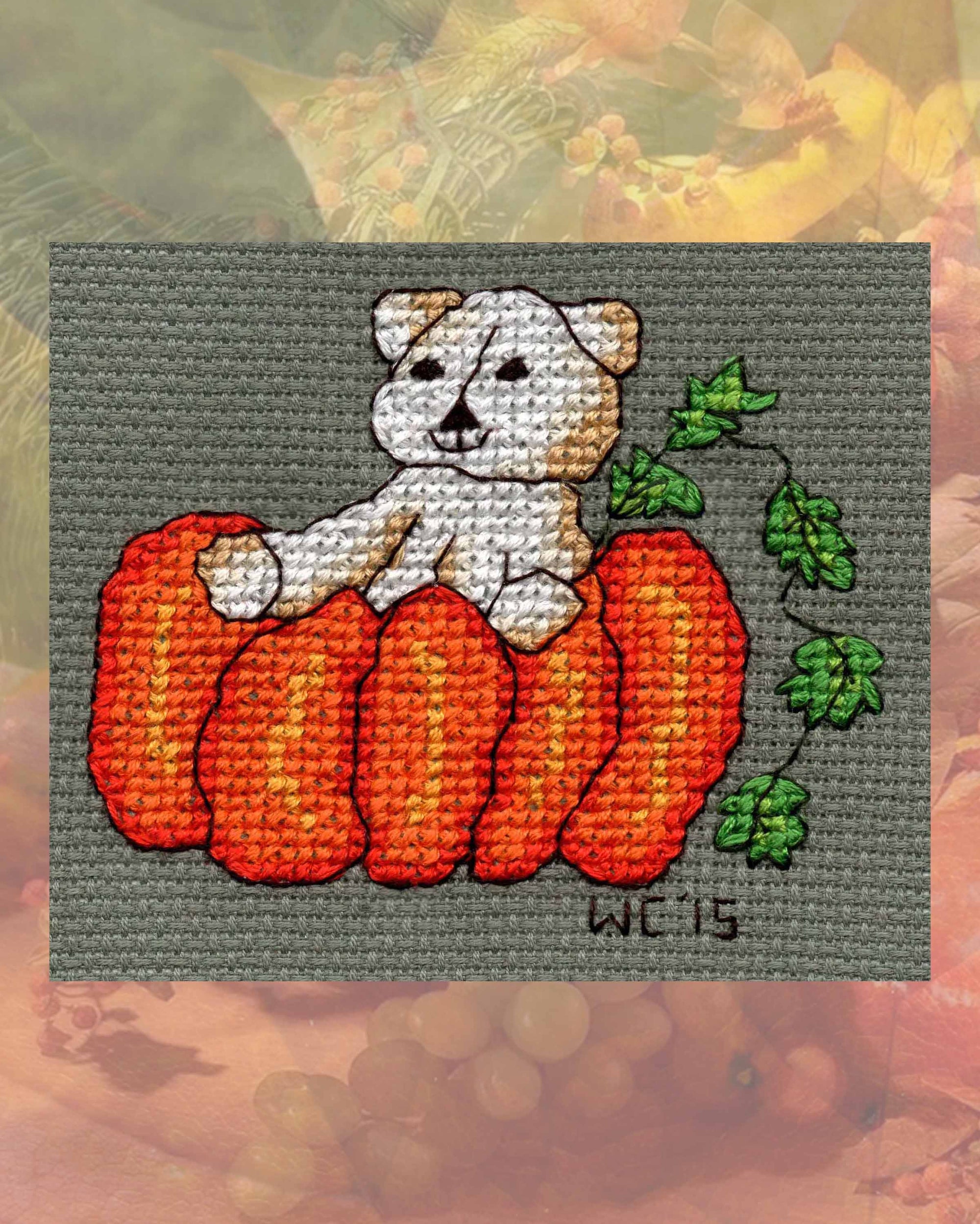 Halloween Cross Stitch Teddy Bear with Giant Orange Pumpkin with green leaves on vine pattern digital PDF download for sale in the four patterns included Four Scary Bears by American artist Wendy Christine at Raspberry Lane Crafts