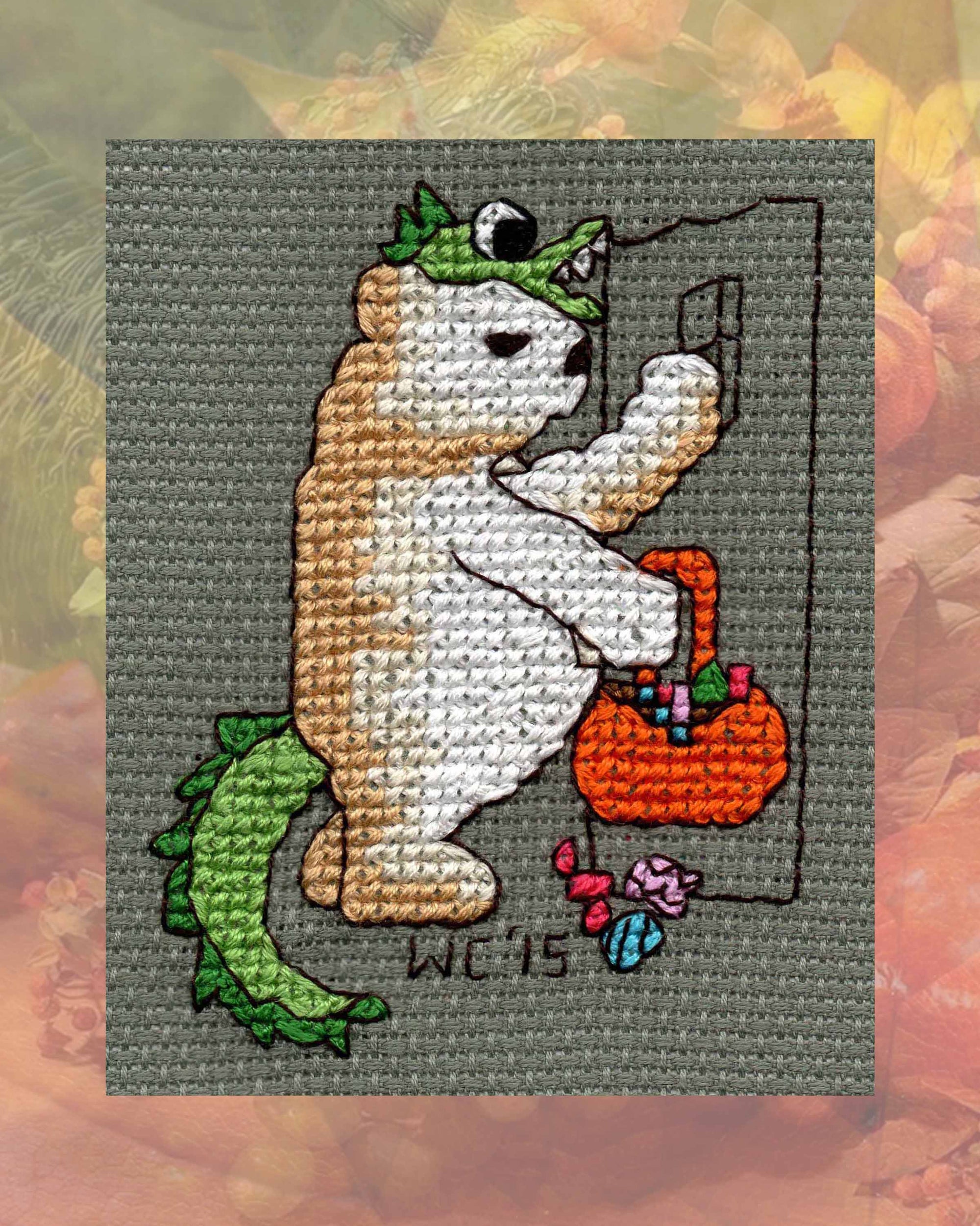 Halloween Cross Stitch Pattern of Teddy Bear with candy and orange trick-or-treat bag and green dragon costume knocking on door by American artist Wendy Christine at www.raspberrylanecrafts.com for sale buy purchase digital download PDF.  Thank you so much!