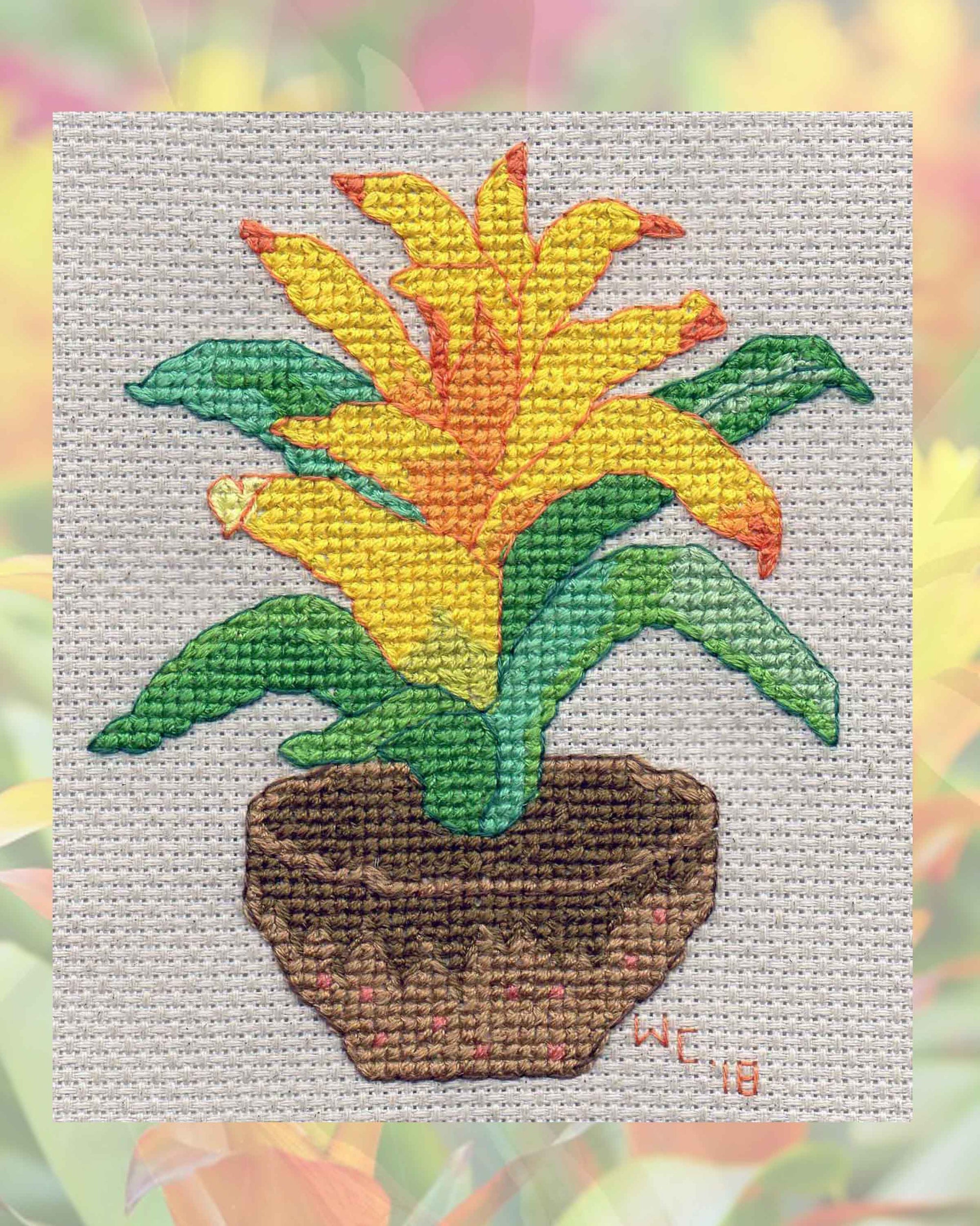 Raspberry Lane Crafts Yellow Bromeliad Cross Stitch Pattern PDF Download Digital File for sale purchase buy features a yellow spiky plant flowering with green spiky leaves and low brown pot by Wendy Christine American artist and designer.  Thanks for supporting our American made products!