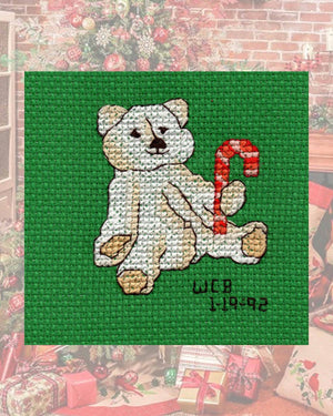 Christmas Tan White Teddy Bear with Red Pink and White Candy Cane Cross Stitch Pattern on Green AIDA fabric is one of four cross-stitch patterns in the Four Jolly Bears Collection available for purchase at Raspberry Lane Crafts by Wendy Christine.  Original Cross Stitch Patterns found only here 