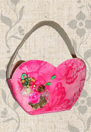 Heart Basket Pattern Download from Raspberry Lane Crafts is a quilted fabric heart-shaped basket in three different sizes to sew and decorate.  Purchase buy find at www.raspberrylanecrafts.com